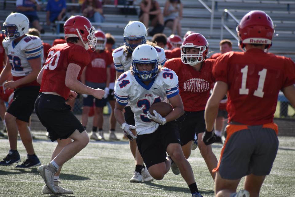 Indian Creek running back Jalen Sauer breaks free during the Braves' scrimmage at Martinsville on June 22, 2022.