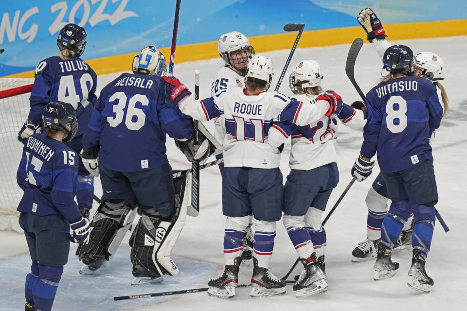 United States' Amanda Kessel (28) is congratulated by Alex Carpenter (25) and Abby Roque (11) after scoring a goal against Finland during a preliminary round women's hockey game at the 2022 Winter Olympics, Thursday, Feb. 3, 2022, in Beijing. (AP Photo/Petr David Josek)