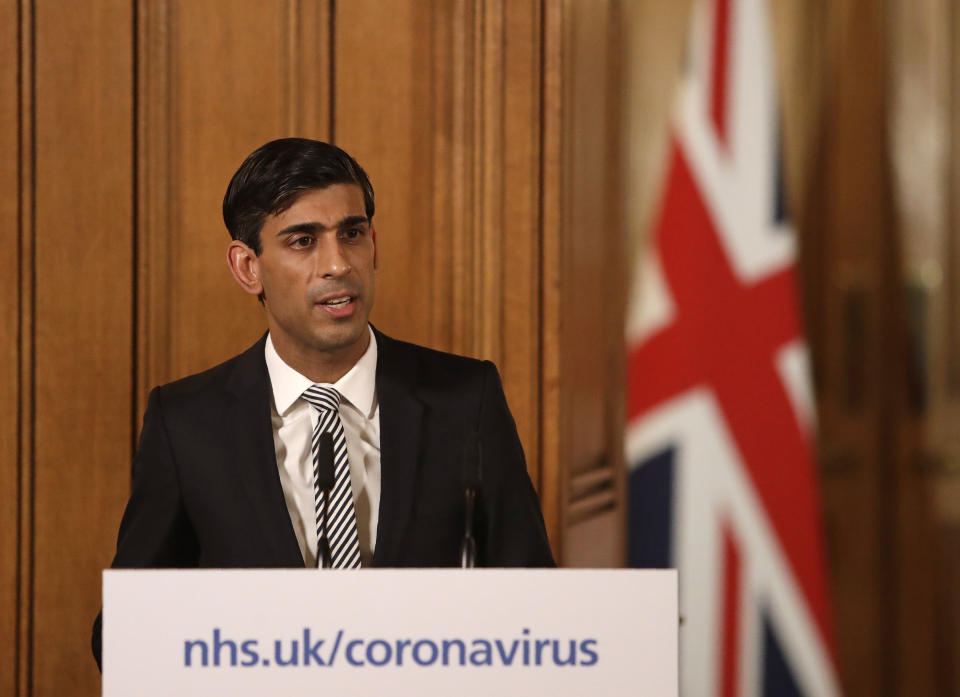 Britain's Chancellor Rishi Sunak gives a press conference about the ongoing situation with the COVID-19 coronavirus outbreak inside 10 Downing Street in London, Tuesday, March 17, 2020. For most people, the new coronavirus causes only mild or moderate symptoms, such as fever and cough. For some, especially older adults and people with existing health problems, it can cause more severe illness, including pneumonia. (AP Photo/Matt Dunham, Pool)