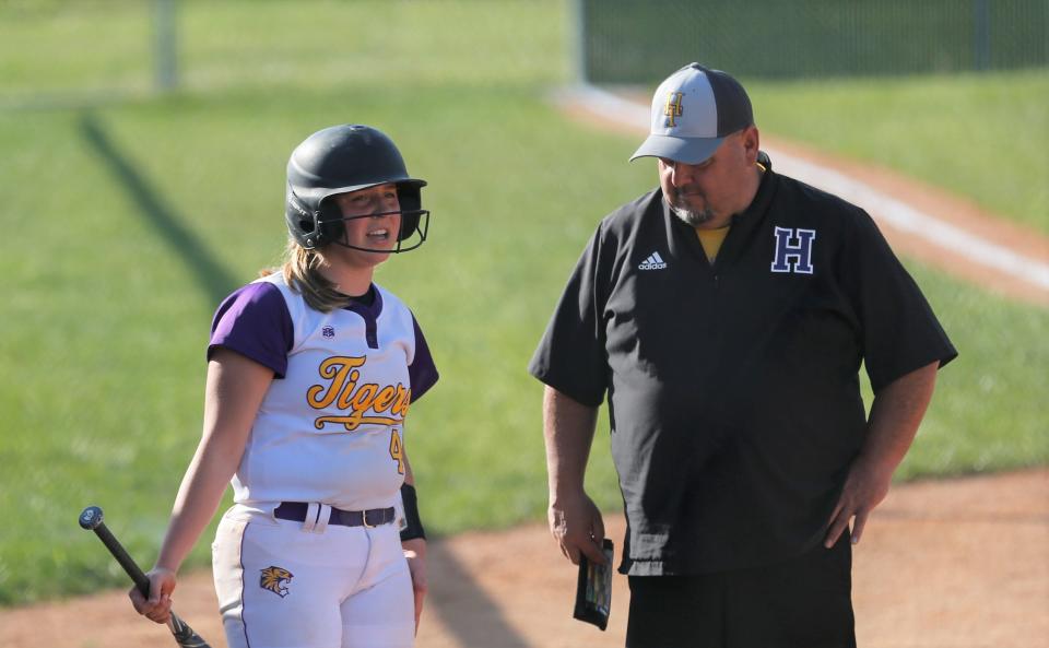 Hagerstown senior Tori Kelley talks to head coach Bruce Charles during a game against Northeastern May 12, 2022.