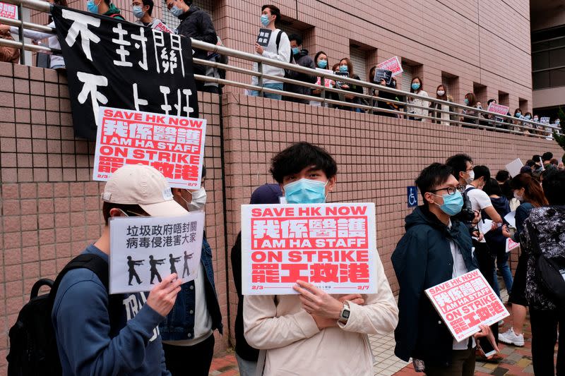 Medical workers hold a strike the outside Hospital Authority as they demand for Hong Kong to close its border with China to reduce the coronavirus spreading, in Hong Kong