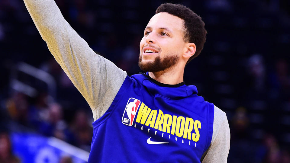 Steph Curry, pictured warming up for the Golden State Warriors, is slated to return to the court in March.