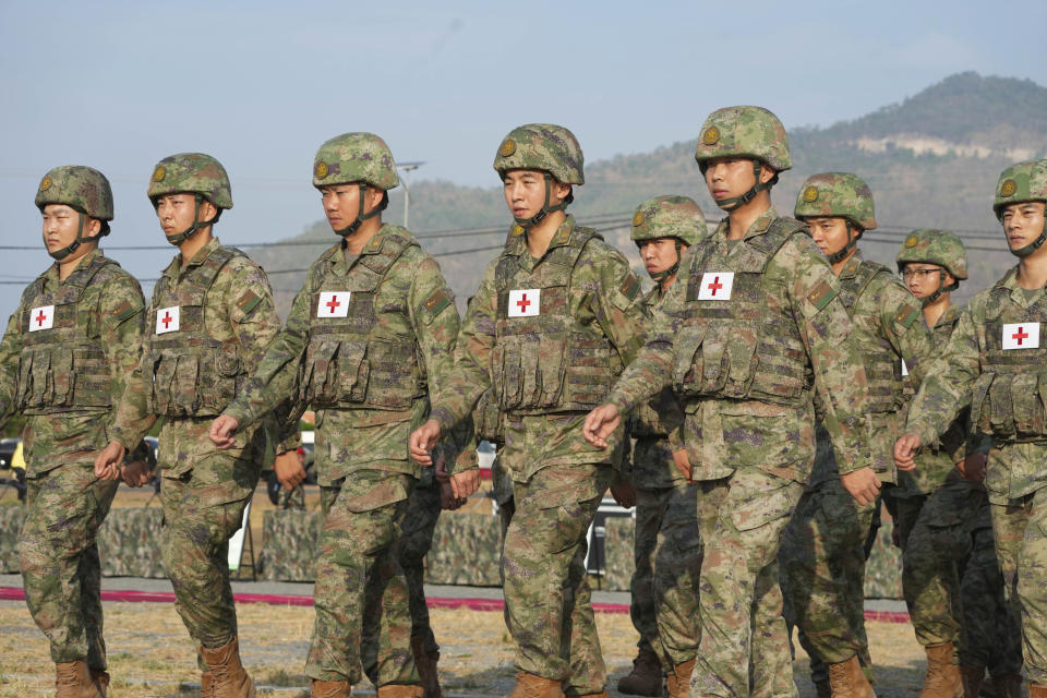 Chinese military personnel head to a field to participate in the Golden Dragon military exercise in Svay Chok village, Kampong Chhnang province, north of Phnom Penh Cambodia, Thursday, May 16, 2024. Cambodia and China on Thursday kicked off their annual Golden Dragon military exercise to strengthen cooperation and exchange military experiences. (AP Photo/Heng Sinith)