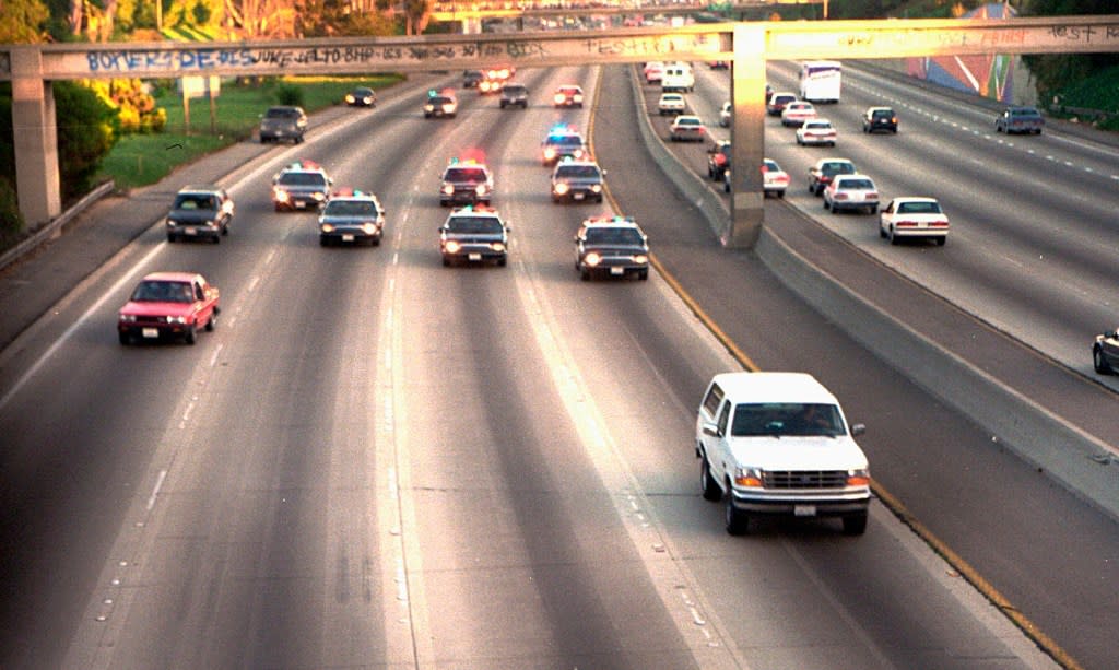 In this June 17, 1994, file photo, a white Ford Bronco, driven by Al Cowlings carrying O.J. Simpson, is trailed by Los Angeles police cars as it travels on a freeway in Los Angeles. (AP Photo/Joseph Villarin, File)