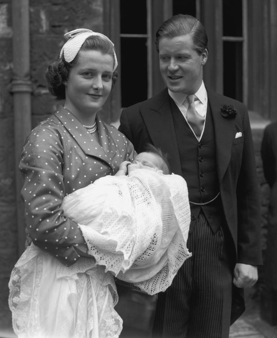 Viscount Althorp with his wife Hon Frances Roche with their baby daughter Sarah, sister of Lady Diana Spencer, after her christening at Westminster Abbey, London, 8th June 1955