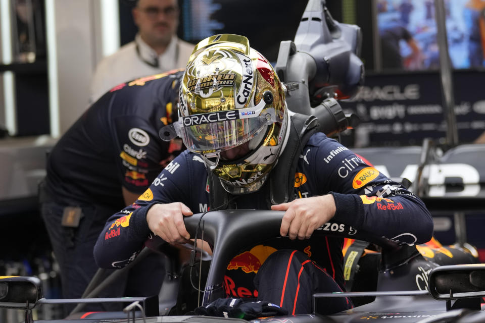 Red Bull driver Max Verstappen of the Netherlands enters his car during practice for thethe Formula One Abu Dhabi Grand Prix, in Abu Dhabi, United Arab Emirates Friday, Nov. 18, 2022. (AP Photo/Kamran Jebreili)
