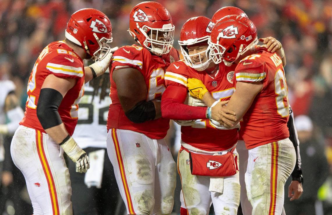 Kansas City Chiefs quarterback Patrick Mahomes (15) is helped up by teammates after being hit during an NFL divisional round playoff game against the Jacksonville Jaguars at GEHA Field at Arrowhead Stadium on Saturday, Jan. 21, 2023, in Kansas City.