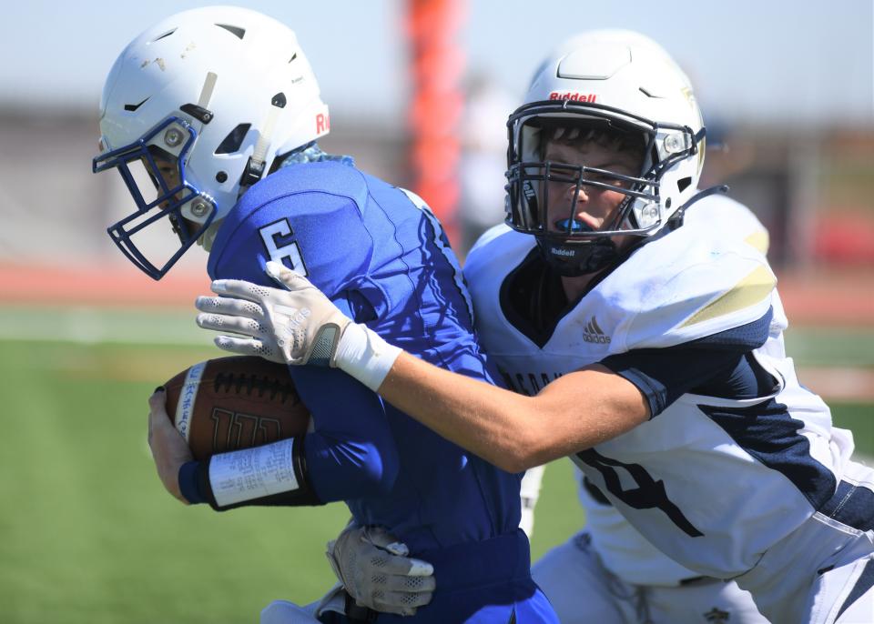 Kingdom Prep's Sam Crews tackles Midland Trinity's Gavin Dorfner (6) in a game Saturday, Oct. 9, 2021, at Archie Warwick Memorial Stadium in Lubbock.