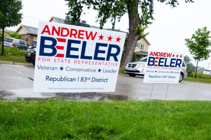 Signs supporting Andrew Beeler are stuck into the grass outside First United Methodist Church Tuesday, Aug. 4, 2020, in Port Huron.