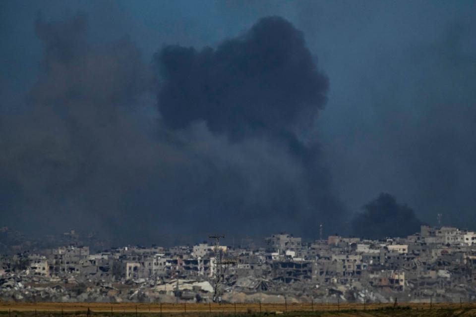 Smoke rises following an Israeli bombardment in the Gaza Strip, as seen from southern Israel, on Boxing Day (AP)