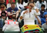 <p>Garbine Muguruza of Spain has a drink during a break in her women’s singles match against Jana Cepelova of Slovakia on day four of the Wimbledon Tennis Championships in London, Thursday, June 30, 2016. (AP Photo/Ben Curtis)</p>