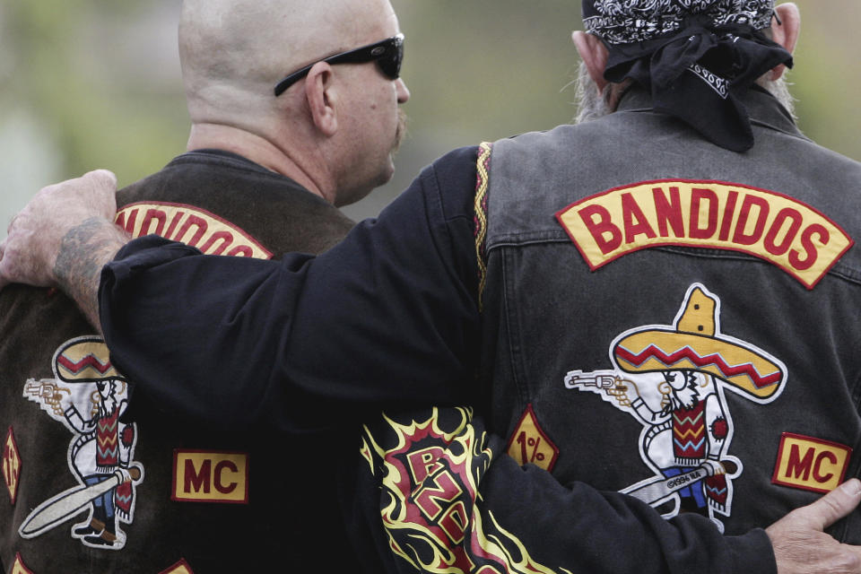 FILE - Members of the Bandidos wait in front of the court in Muenster, western Germany, on June 10, 2008. Danish police said Wednesday, May 22, 2024, they are issuing a temporary and immediate ban on the Danish arm of the Bandidos motorcycle club, citing the group’s violent behavior. (AP Photo/Roberto Pfeil, File)