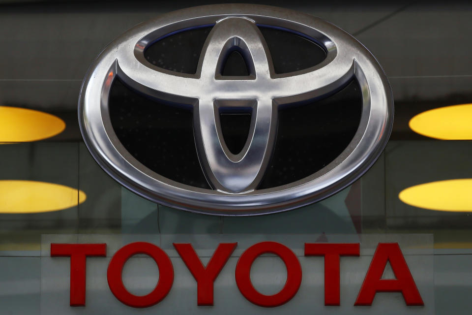 FILE - This Sept. 20, 2017, file photo shows the Toyota logo at their shop on the Champs Elysees Avenue in Paris. Toyota is recalling about 70,000 Toyota and Lexus brand vehicles in North America to replace air bag inflators that could explode and hurl shrapnel at drivers and passengers. The recall covers the 2003 to 2005 Corolla, the 2002 to 2005 Sequoia, the 2003 to 2005 Tundra and the 2002 to 2005 Lexus SC. (AP Photo/Francois Mori, File)