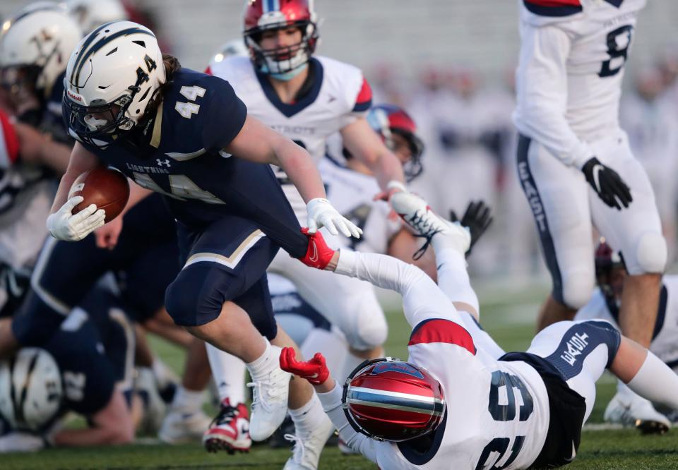 Appleton North High School's Cal Martine (44) breaks away from Appleton East High School's Kenan Rollins (29) to run for a touchdown during their football game Friday, March 26, 2021, at Appleton North High School in Appleton, Wis. Appleton North won 49-31.Dan Powers/USA TODAY NETWORK-Wisconsin