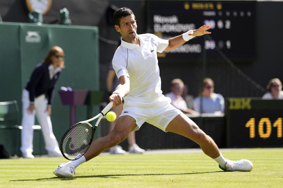 Serbia's Novak Djokovic returns the ball to Serbia's Miomir Kecmanovic in a men's singles match on day five of the Wimbledon tennis championships in London, Friday, July 1, 2022. (AP Photo/Alberto Pezzali)