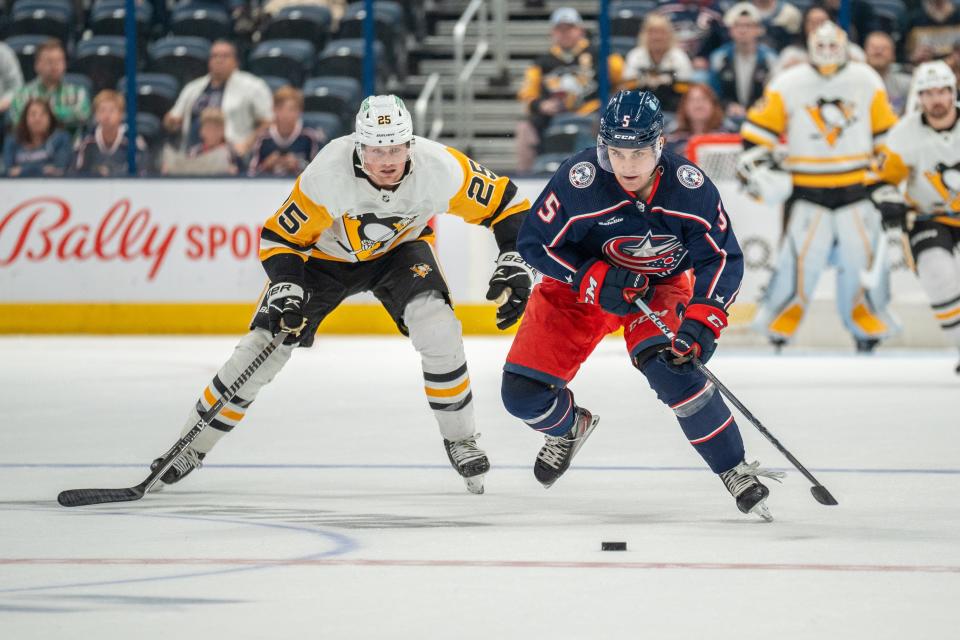 Sep 24, 2023; Columbus, OH, USA;
Columbus Blue Jackets defender Denton Mateychuk (5) races towards the puck against Pittsburgh Penguins left wing Austin Wagner (25) during their game on Sunday, Sept. 24, 2023 at Nationwide Arena.