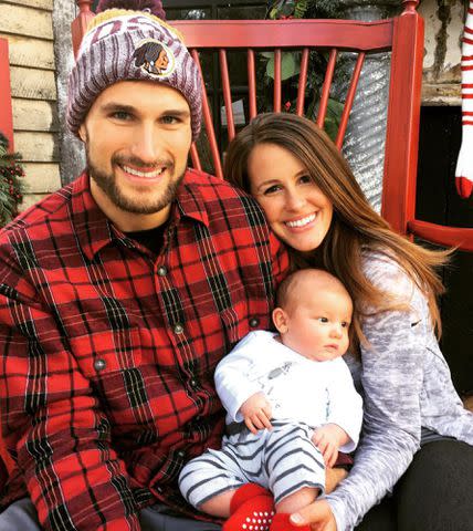 <p>Julie Cousins Instagram</p> Kirk Cousins posing with wife Julie Hampton and their son