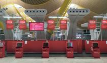 Empty Iberia check-in counters are seen at Madrid's Adolfo Suarez Barajas Airport