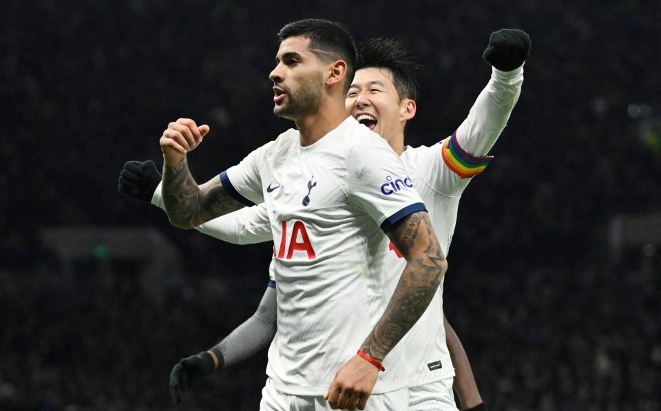 Tottenham Hotspur's Cristian Romero celebrates scoring their first goal with Son Heung-min