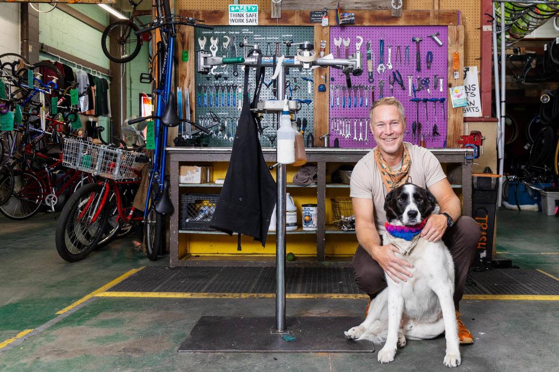 Jimmy Hallyburton, executive director and founder of Boise Bicycle Project, is pictured with his dog Ned at the Boise Bicycle Project on Lusk Street.