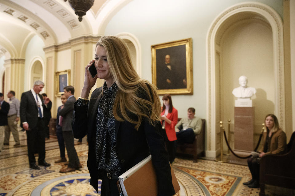 Sen. Kelly Loeffler, R-Ga., walks through the Capitol, Monday, Jan. 27, 2020, in Washington, before the impeachment trial of President Donald Trump on charges of abuse of power and obstruction of Congress. (AP Photo/ Jacquelyn Martin)