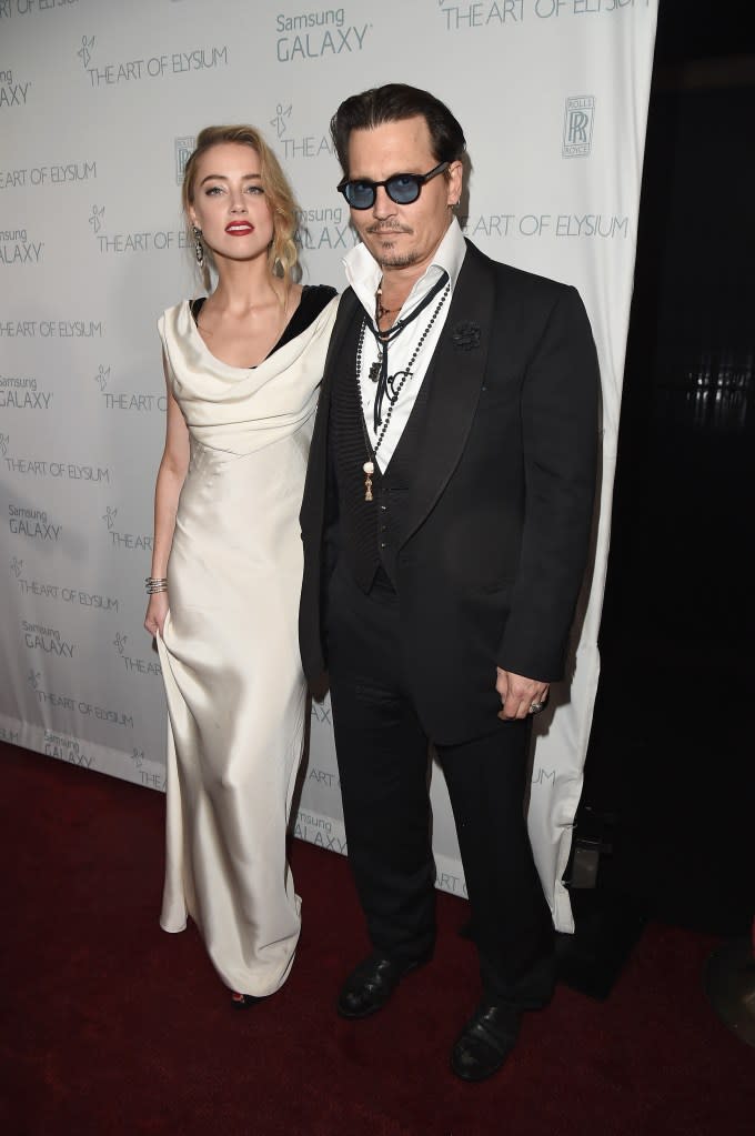 Amber Heard and Johnny Depp. Getty Images for Art of Elysium