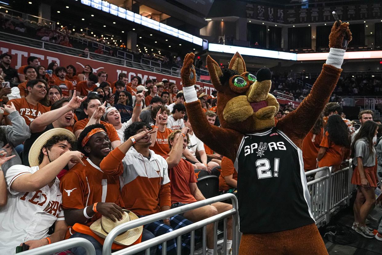 The Coyote — the mascot for the San Antonio Spurs — takes a selfie with fans during the March 2 game between Texas and Oklahoma State at Moody Center. The Spurs are making their return trip to Austin this weekend for games at Moody on Friday and Sunday.