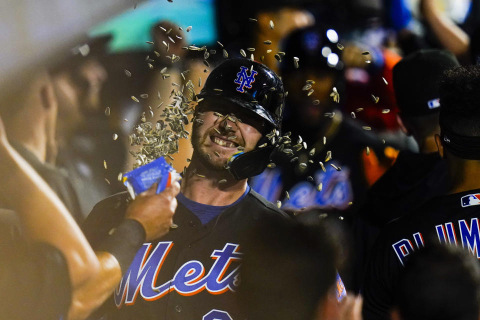 New York Mets' Pete Alonso celebrates with teammates after hitting a grand slam during the sixth inning of a baseball game against the Miami Marlins, Friday, June 17, 2022, in New York. (AP Photo/Frank Franklin II)