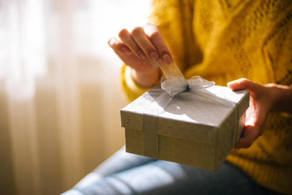 Woman opening gift