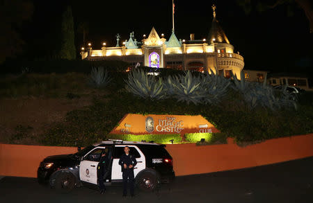 FILE PHOTO - Los Angeles Police Department (LAPD) officers control the entrance at the Magic Castle magicians' club in the Hollywood neighborhood of Los Angeles, California, U.S. February 24, 2017. REUTERS/Chris Helgren/File Photo