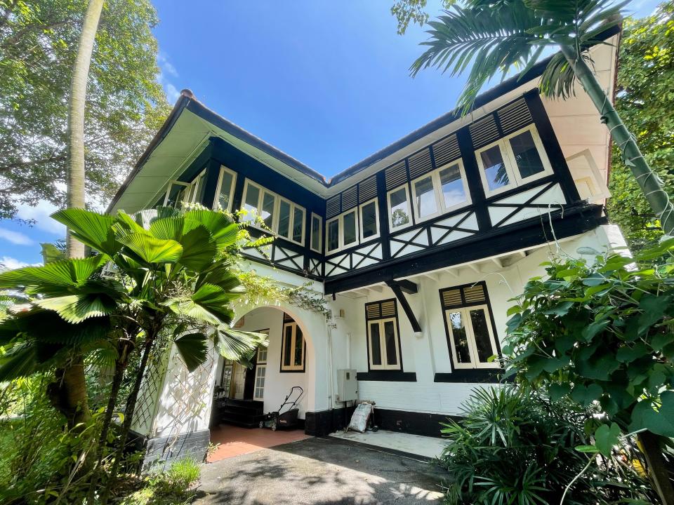 The exterior of the black and white colonial house