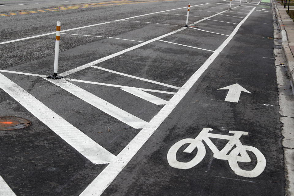 Parking spaces are empty on what is usually a busy Madison Ave. in the Village of Oak Park, Ill., Friday, March 20, 2020. There are at least three confirmed cases of COVID-19 in Oak Park, just nine miles from downtown Chicago, where the mayor has ordered residents to shelter in place. With so few tests available, surely there are others, says Tom Powers, spokesman for the village of about 52,000 in a metropolitan area with millions. (AP Photo/Charles Rex Arbogast)