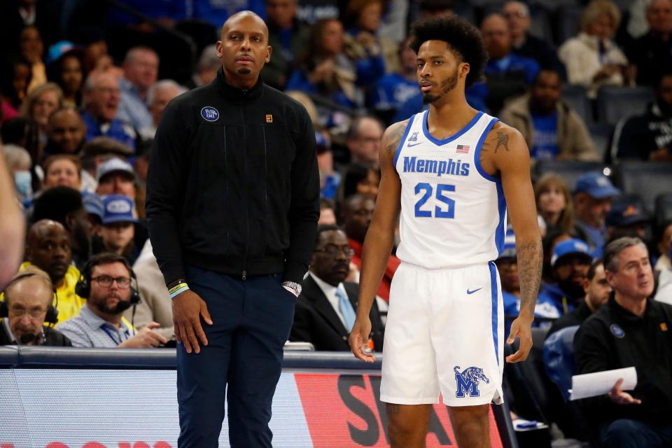 Dec 30, 2023; Memphis, Tennessee, USA; Memphis Tigers head coach Penny Hardaway (left) talks with guard Jayden Hardaway (25) during the first half against the Austin Peay Governors at FedExForum. Mandatory Credit: Petre Thomas-USA TODAY Sports