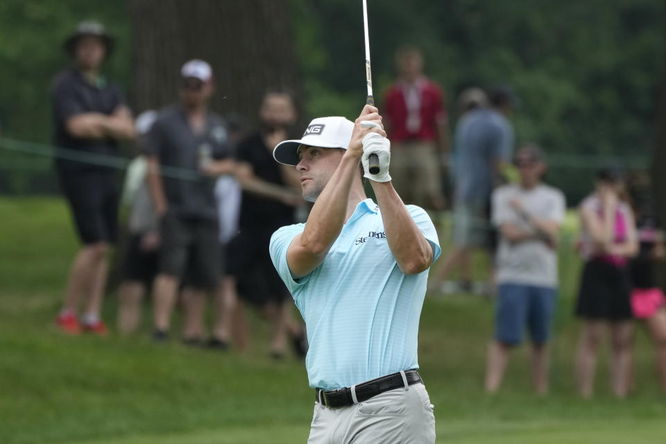 Taylor Moore hits his approach shot onto the first green during the third round of the Rocket Mortgage Classic golf tournament at Detroit Country Club, Saturday, July 1, 2023, in Detroit. (AP Photo/Carlos Osorio)