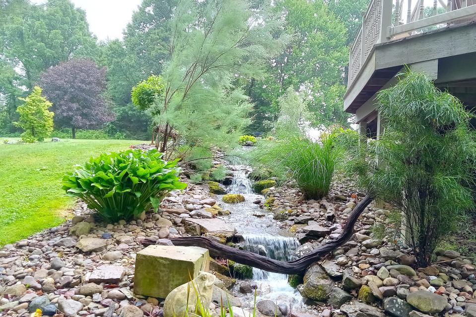 Water, wood and rocks are part of the lovely garden at Bill and Lisa Pim's home on Township Road 262, part of this year's Holmes County Garden Tour.