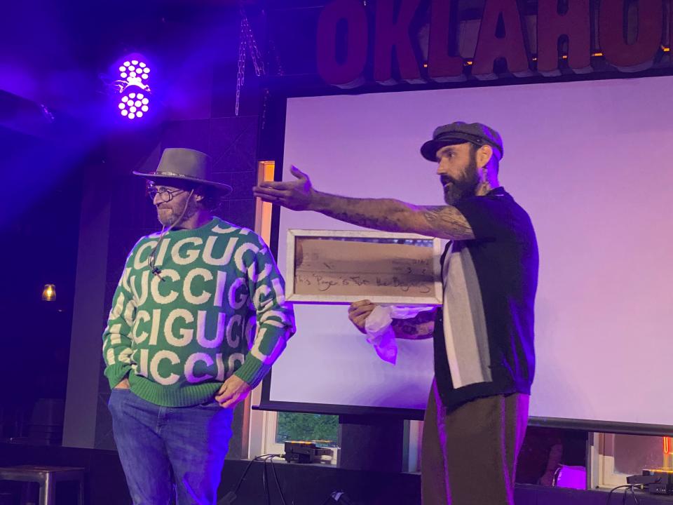 Trent Ward, left, and chef Zach Hutton address a crowd on April 9, announcing the name of their new concept during a "Chopped" watch party at Ponyboy in Oklahoma City.