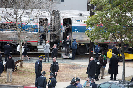 FILE PHOTO: U.S. Capitol Police officers and state troopers keep watch after an Amtrak passenger train carrying Republican members of the U.S. Congress from Washington to a retreat in West Virginia collided with a garbage truck in Charlottesville, Virginia, U.S., January 31, 2018. REUTERS/Eze Amos