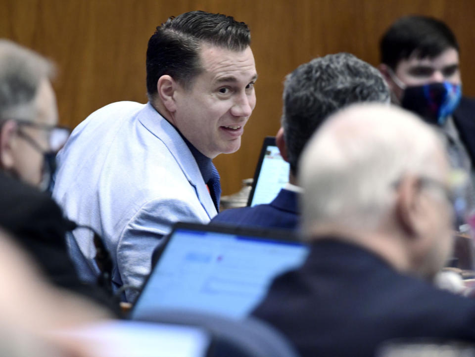 State Rep. Luke Simons, R-Dickinson, is shown in the North Dakota House chamber on Wednesday, Feb. 24, 2021, n Bismarck, N.D. Lawyers for the North Dakota Legislature have documented allegations of sexual harassment and threats against them and others by Republican lawmaker Luke Simons, and have forwarded a file to legislative leaders for potential action that may lead to possible censure or expulsion. Legislative Council Director John Bjornson said he decided to release the documents Thursday, Feb. 24, 2021, after an incident Tuesday at the Capitol cafeteria where Simons accosted a pair of Democratic lawmakers in a profane outburst over a disagreement about wearing a mask. (Blake Nicholson/The Bismarck Tribune via AP)