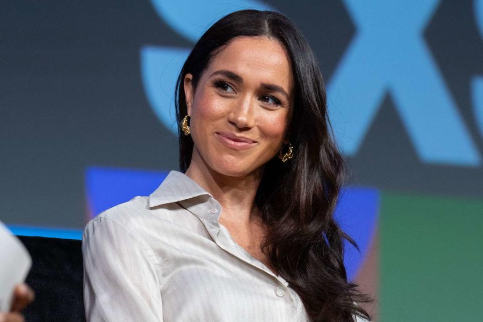 <p>SUZANNE CORDEIRO/AFP via Getty</p> Meghan Markle smiles on stage during the Breaking Barriers, Shaping Narratives: How Women Lead On and Off the Screen keynote panel at the SXSW 2024 Conference and Festivals at the Austin Convention Center on March 8, 2024, in Austin, Texas.