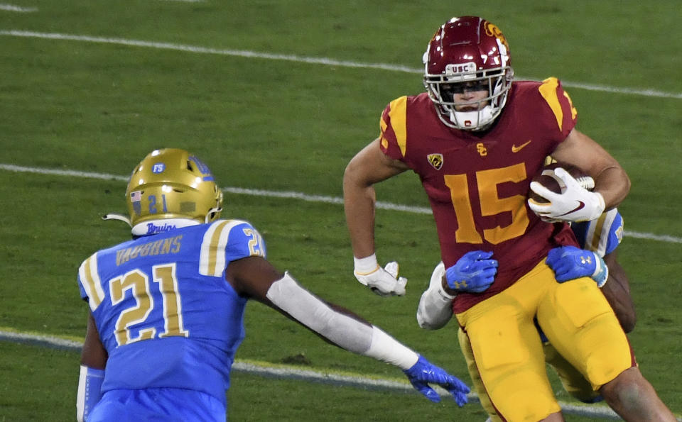 Wide receiver Drake London #15 of the USC Trojans catches a pass for yardage against the UCLA Bruins in the first half of a NCAA Football game at the Rose Bowl in Pasadena on Saturday, December 12, 2020. (Keith Birmingham/The Orange County Register via AP)