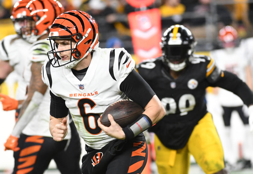 Dec 23, 2023; Pittsburgh, Pennsylvania, USA; Cincinnati Bengals quarterback <a class="link " href="https://sports.yahoo.com/nfl/players/32138" data-i13n="sec:content-canvas;subsec:anchor_text;elm:context_link" data-ylk="slk:Jake Browning;sec:content-canvas;subsec:anchor_text;elm:context_link;itc:0">Jake Browning</a> (6) runs against the Pittsburgh Steelers during the third quarter at Acrisure Stadium. The Steelers won 34-11. Mandatory Credit: Philip G. Pavely-USA TODAY Sports