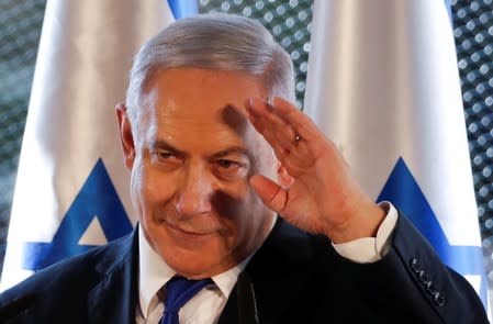 Israeli Prime Minister Benjamin Netanyahu gestures as he speaks during a state memorial ceremony at the Tomb of the Patriarchs, a shrine holy to Jews and Muslims, in Hebron