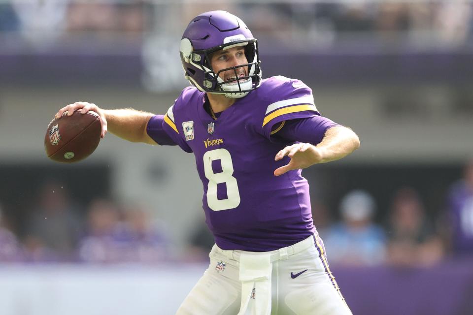 MINNEAPOLIS, MINNESOTA - OCTOBER 10: Kirk Cousins #8 of the Minnesota Vikings looks to throw the ball during the second quarter against the Detroit Lions at U.S. Bank Stadium on October 10, 2021 in Minneapolis, Minnesota. (Photo by Elsa/Getty Images)