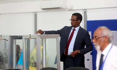 A Somali lawmaker casts his ballot during the presidential vote at the airport in Somalia's capital Mogadishu February 8, 2017. REUTERS/Feisal Omar