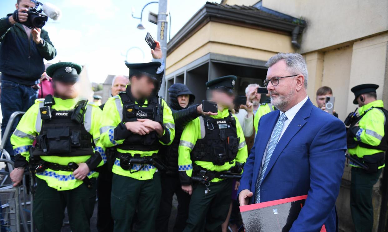 <span>Jeffrey Donaldson leaving Newry courthouse on 10 September after the brief arraignment hearing. NOTE: Faces blurred at the request of PSNI.</span><span>Photograph: Charles McQuillan/Getty Images</span>