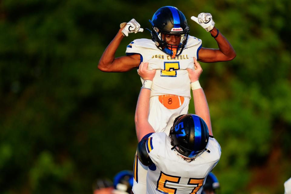 John Carroll Catholic’s wide receiver Marion Fredrick (6) celebrates his touchdown against Port St. Lucie in a preseason kick off classic football game on Friday, Aug. 19, 2022, in Port St. Lucie. John Carroll Catholic won 34-0.