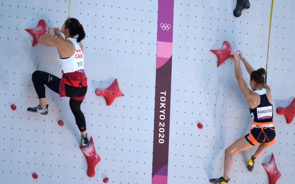 Alannah Yip, of Canada, right, races against Brooke Raboutou, of the United States, during the speed qualification portion of the women's sport - AP