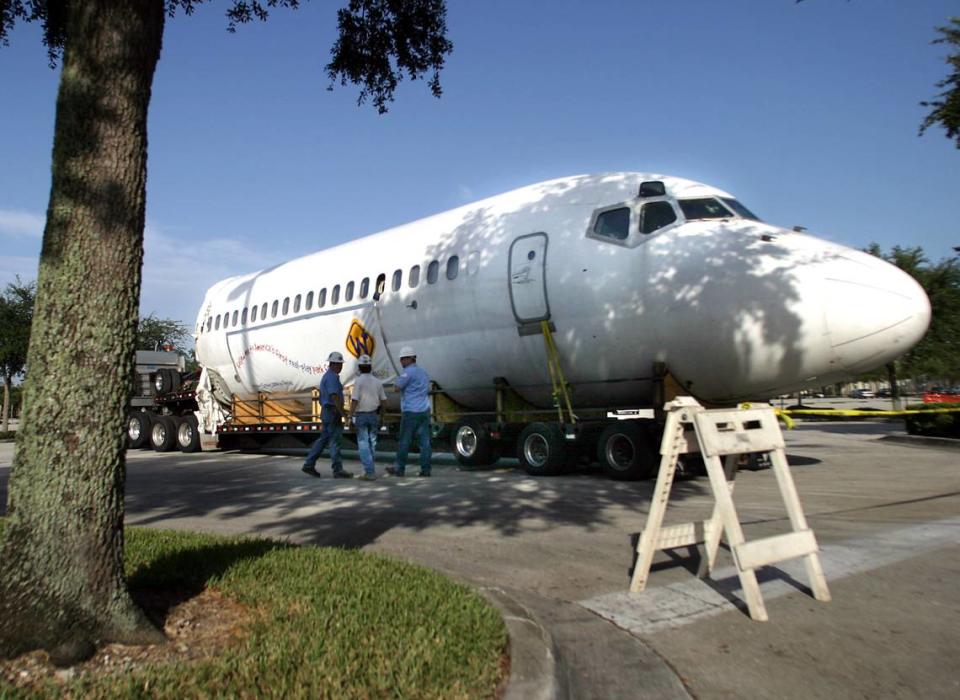 A retired DC-9 is moved into Wannado City at Sawgrass Mills mall in Sunrise.