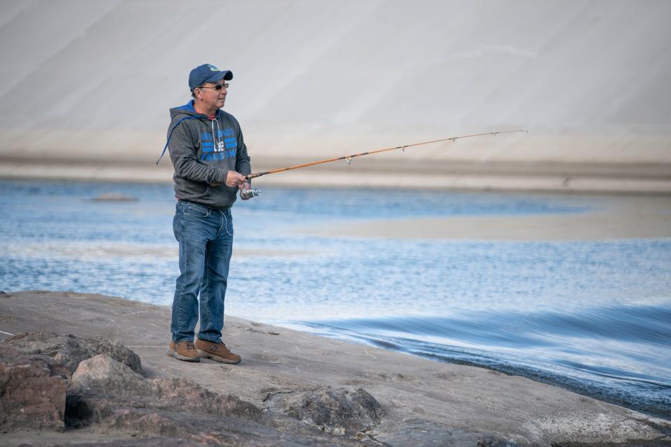 Davis Valdez fishes along the Arkansas River in Pueblo on Wednesday, March 6, 2024.