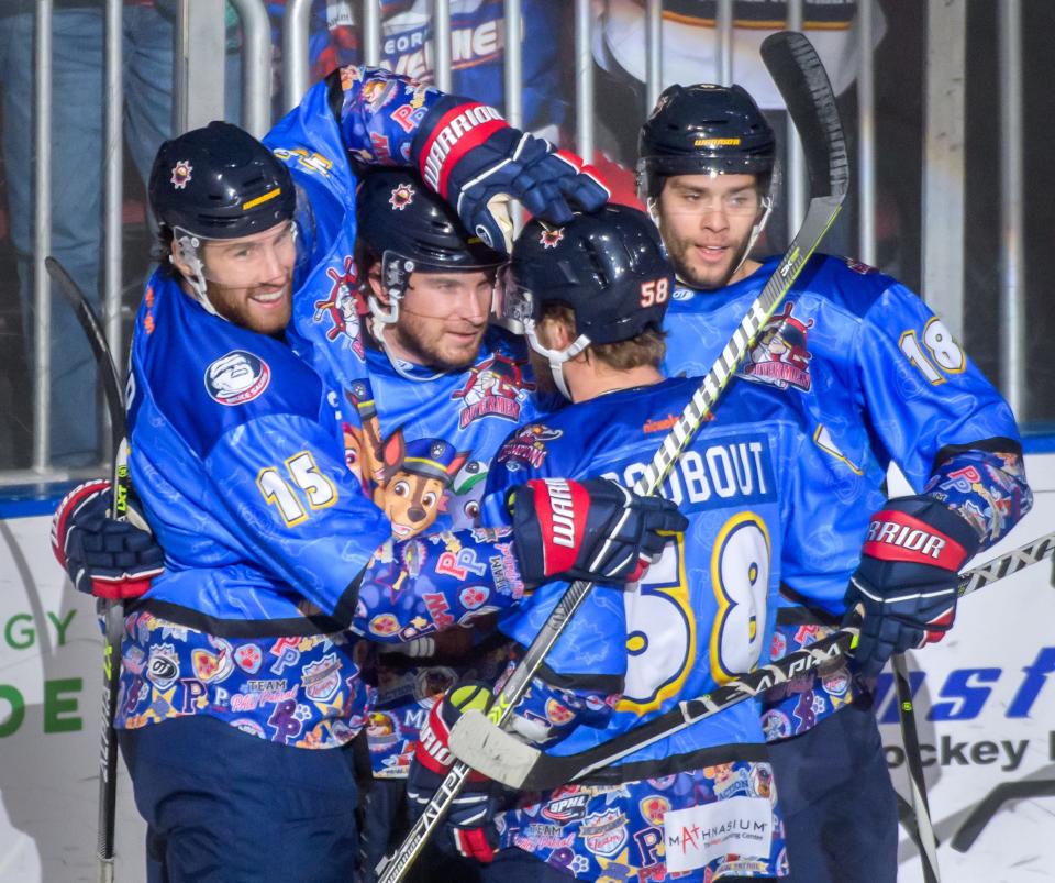 New Peoria Rivermen winger Alex Carrier (15) celebrates with teammates Braydon Barker, right, Marcel Godbout (58) and Dale Deon after Deon's goal against Knoxville on Saturday, Jan. 14, 2023 at Carver Arena. Carrier assisted on the goal in his first start with the Rivermen since the 2014-15 season.